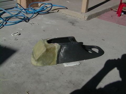 1999 Ford Taurus - Custom dashboard part, possibly for a car, made from fiberglass and black plastic.