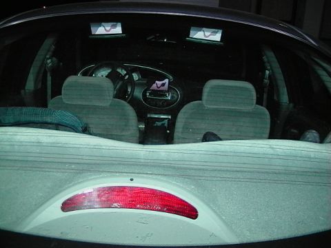 1999 Ford Taurus - View of the interior of a 1999 Ford Taurus, including the dashboard and front seats.