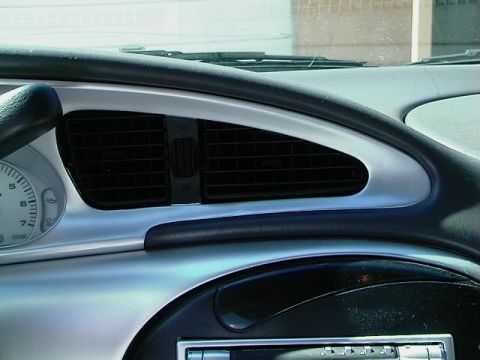 1999 Ford Taurus - Close-up of a dashboard air vent and instrument cluster, likely from a vehicle not matching the registry's claim.