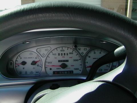 1999 Ford Taurus - The interior of a 1999 Ford Taurus, showing the instrument cluster with the odometer reading 129,103 miles.