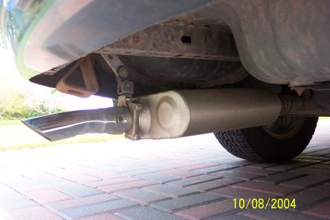 1996 Mercury Sable - The rear exhaust system of a vehicle is shown, including the muffler and a chrome-tipped tailpipe.