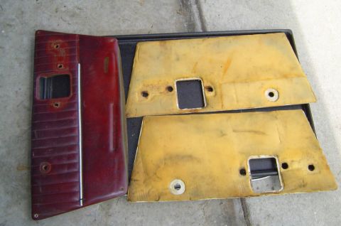 1993 Ford Bronco - Red and yellow door panels are laid out on a black tray.