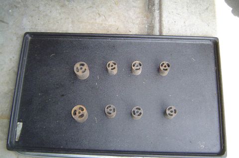 1993 Ford Bronco - Collection of metal spacers laid out on a dark tray.