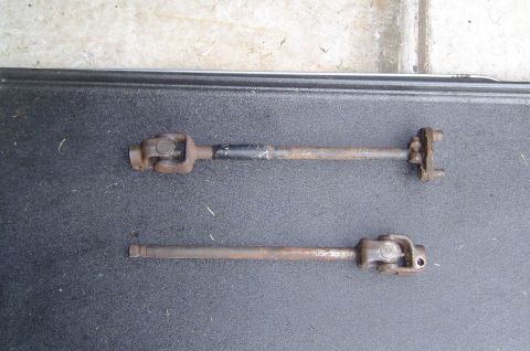 1993 Ford Bronco - Two steering shafts, likely for a vehicle, are shown side-by-side.