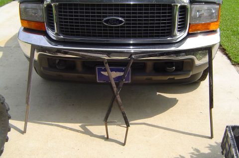 1993 Ford Bronco - Front view of a Ford truck, likely from the early 2000s, with a metal stand obscuring the bumper.