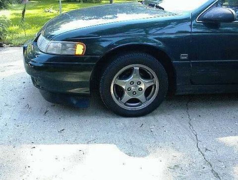 1993 Ford Taurus - My 93 with Gen 3 wheels and a front spoiler.