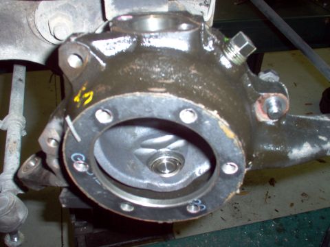 1983 Ford Bronco - With the bearing on the pin, slip the knuckle onto the ball & put the large seal in place.