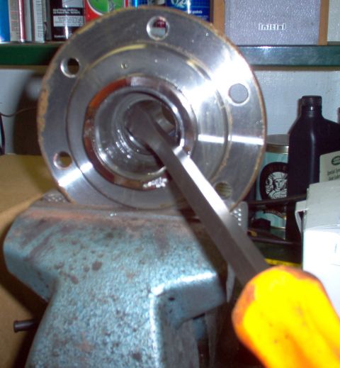 1983 Ford Bronco - Pry out the spindle seal.