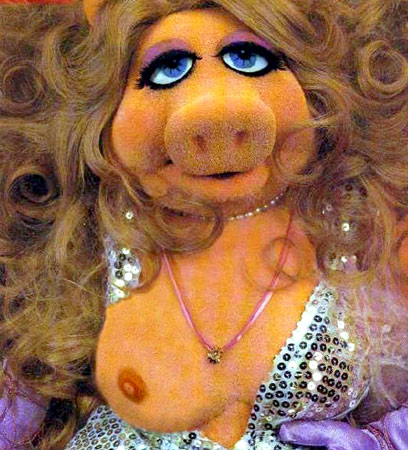 1995 Ford Bronco - A close-up of the Muppet character Miss Piggy, adorned with makeup and a sparkly outfit.