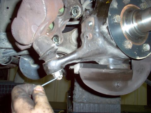 1983 Ford Bronco - Reinsert the tie rod ends into the steering knuckle, making sure the holes point directly outward. Tighten the 19mm castellated nuts so a c…
