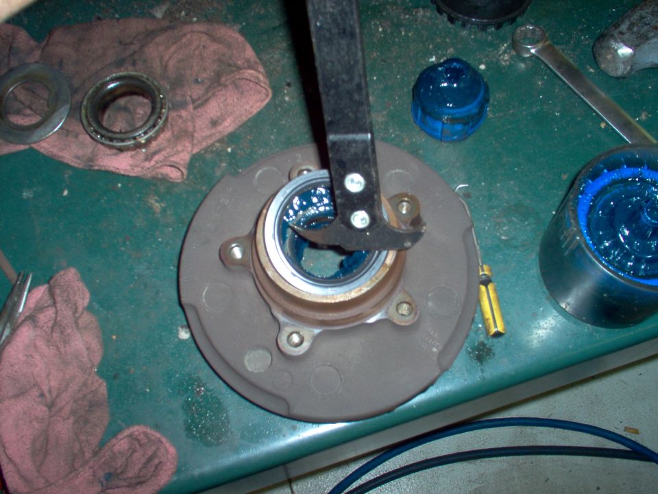Pull the hub seal, remove & clean the wheel bearings.