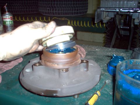 1983 Ford Bronco - Drop in the inner wheel bearing & install a new hub seal. Note that it should be recessed in the hub. The white plastic disk is the special…