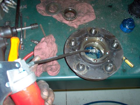 1983 Ford Bronco - Fill the area between the bearing races with grease. This prevents the bearings from throwing their grease out, and reduces the amount of a…