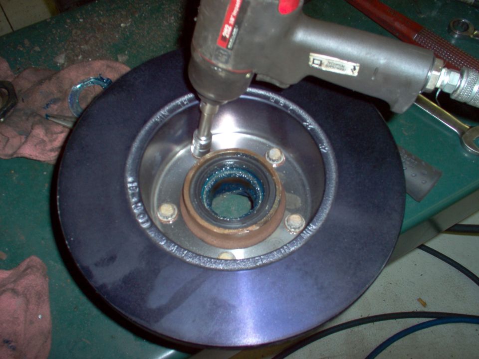 Install the rotor, using anti-sieze lubricant where it presses onto the hub, and on the bolts.  The heads are 12-point 14mm.