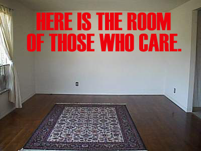1986 Ford Bronco - An empty room with a rug and large red text on the wall reads 'HERE IS THE ROOM OF THOSE WHO CARE.'