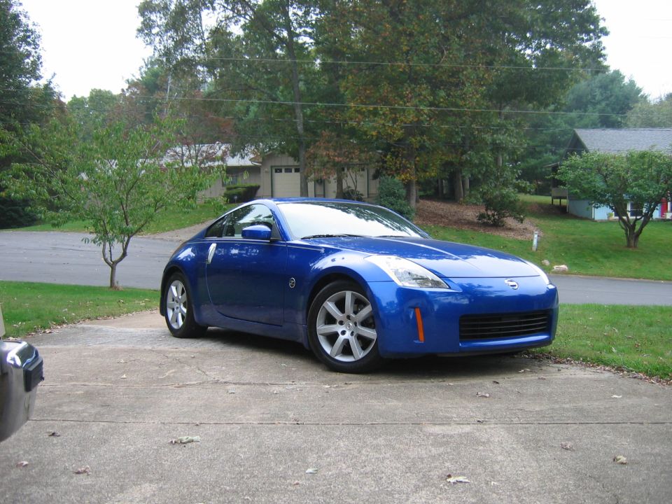 Blue coupe parked on driveway