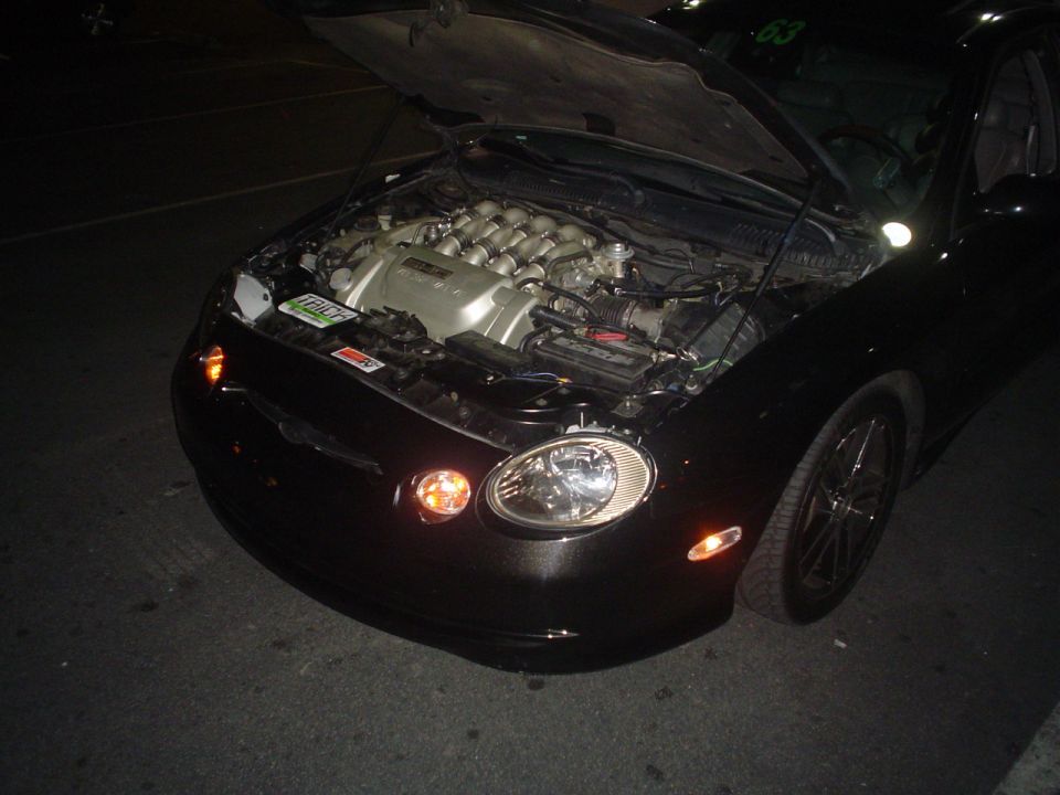 1993 Ford Taurus front view, hood open revealing engine