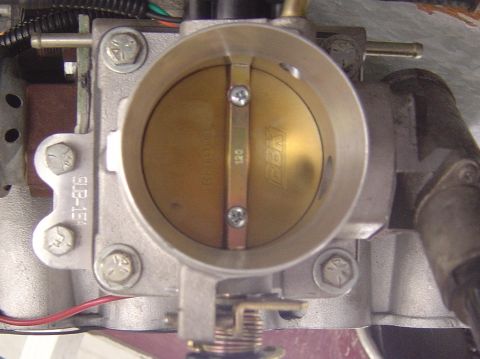 1993 Ford Bronco - Close-up of a throttle body, showing the BBK logo and a numerical marking.