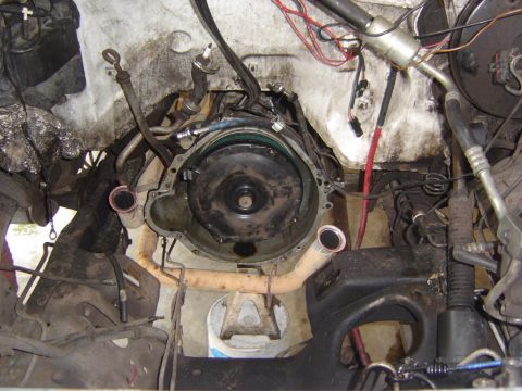 1993 Ford Bronco - Close-up view of the engine and transmission connection point, showing the torque converter and surrounding components.
