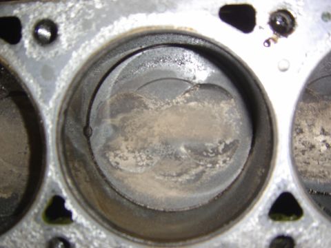 1993 Ford Bronco - Close-up view of engine cylinders and pistons, indicating wear and tear.