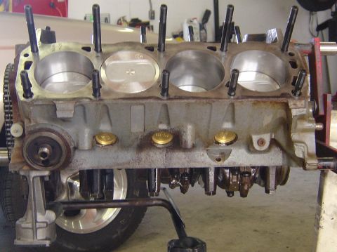 1993 Ford Bronco - Engine block assembly with pistons and connecting rods, likely undergoing repair or rebuild.