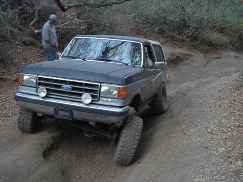 1989 Ford Bronco - This 1989 Ford Bronco navigates a challenging off-road path.