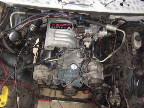 1993 Ford Bronco - Engine bay a 5.0 COBRA intake manifold, likely from a Ford vehicle.