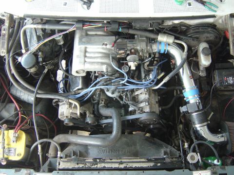 1993 Ford Bronco - Engine bay view showing V8 engine components and wiring.