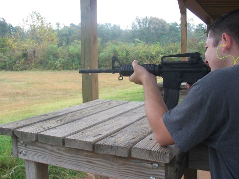 1988 Ford Bronco - Shooting at an outdoor range with a rifle.
