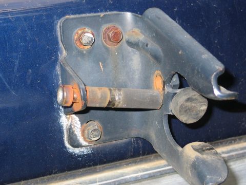1995 Ford Bronco - Rusty door latch mechanism on a blue vehicle.