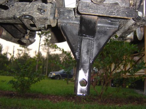 1993 Ford Bronco - Close-up view of a trailer hitch receiver, with a dark SUV visible in the background.