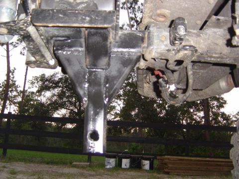 1993 Ford Bronco - Close-up view of a trailer hitch receiver assembly, showing mechanical components and wiring.