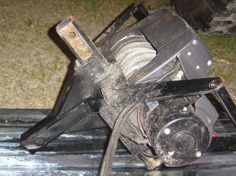 1993 Ford Bronco - Close-up of a winch and brushguard assembly, showing the motor and cable spool.