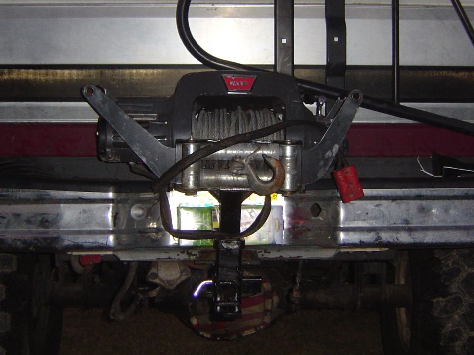 Vehicle front bumper with a Warn winch and hook attached