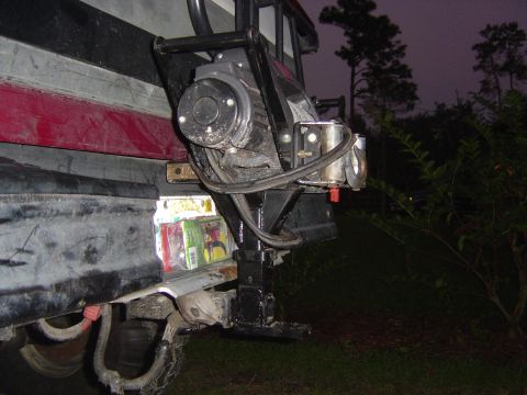 1993 Ford Bronco - A winch and brushguard assembly is mounted on the rear of a vehicle, with a license plate visible below.