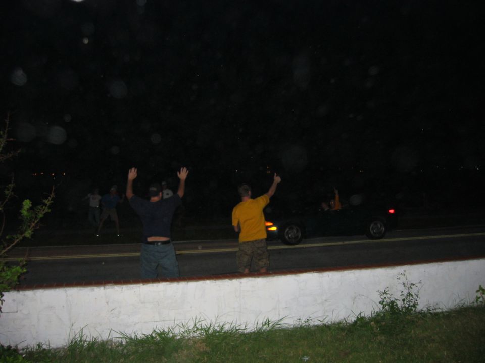 Full blown drunk with the hurricane still on the way...the party is now 100 percent outside in the elements...and we are harassing cars driving by hopin they will come drink with us