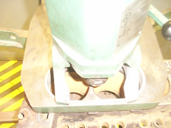 Engine cylinder heads being machined, close-up view