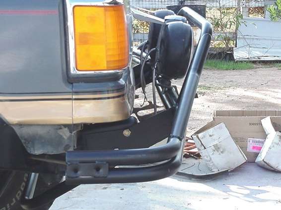 Close-up of a custom tubular front bumper on an SUV's corner