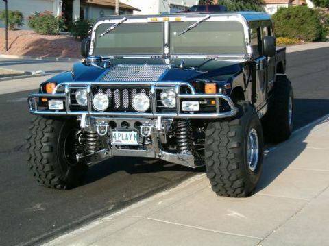 1982 Ford Bronco - Hummer H1 front view shows custom grille and '4 PLAY N' license plate.