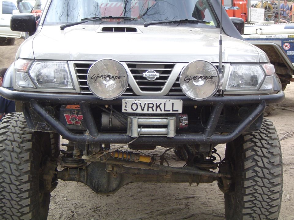 Nissan Patrol front end with winch, off-road lights, and custom bumper