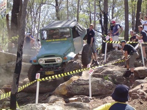 1982 Ford Bronco - Off-road vehicle navigates a challenging rocky course during a competition.