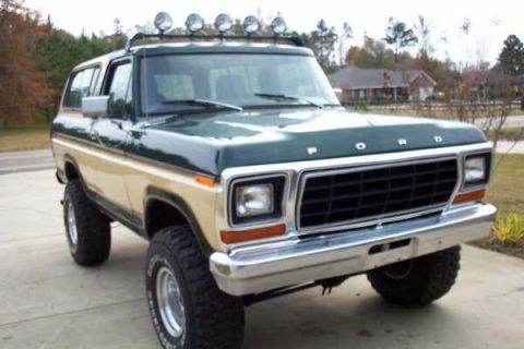 1978 Ford Bronco - This two-tone 1978 Ford Bronco features a roof-mounted light bar and aggressive off-road tires.