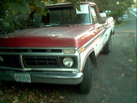 1978 Ford Bronco - This 1978 Ford F-250 pickup truck is parked on the side of a road.