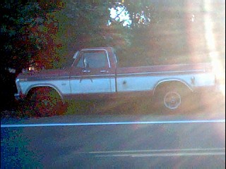 1978 Ford Bronco - This two-tone Ford F-Series pickup truck appears to be from the mid-1970s, likely a 1975 model based on its body style.