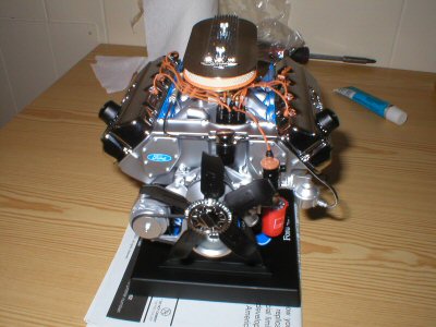 1987 Ford Crown Victoria LTD - A detailed model of a Ford V8 engine sits on a display stand.