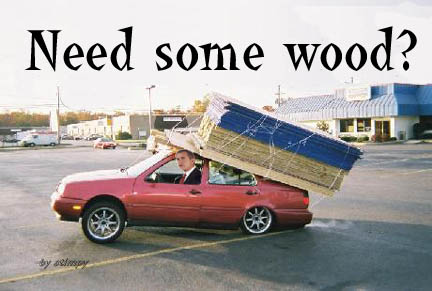 1994 Ford Crown Victoria - A man in a suit drives a red sedan overloaded with lumber, with the text 'Need some wood?' above.