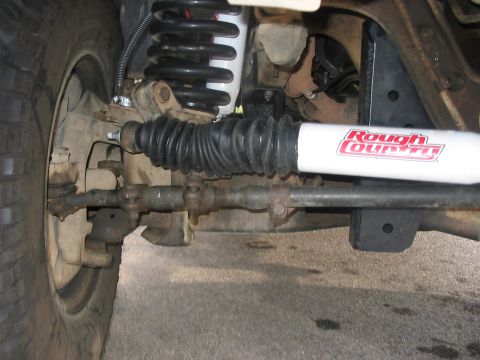 1988 Ford Bronco - Vehicle steering linkage and suspension components are visible in this close-up shot.