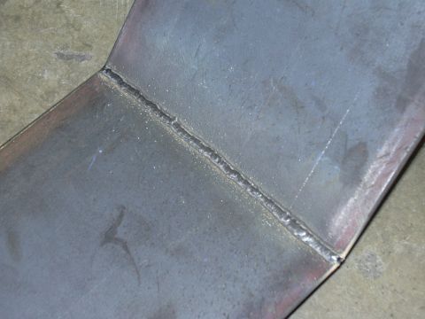 1991 Ford Bronco - Close-up view of a metal part showing a welded seam.