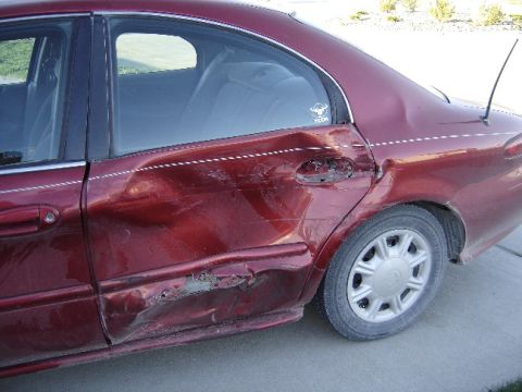 1998 Mercury Sable - This 1998 Mercury Sable sedan sustained significant damage to its rear passenger side door and quarter panel.