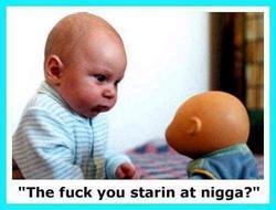 1995 Ford Taurus - A baby confronts a doll with an aggressive expression.